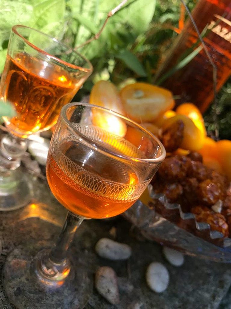 two glasses of kumquat liqueur from Lazaris Distillery