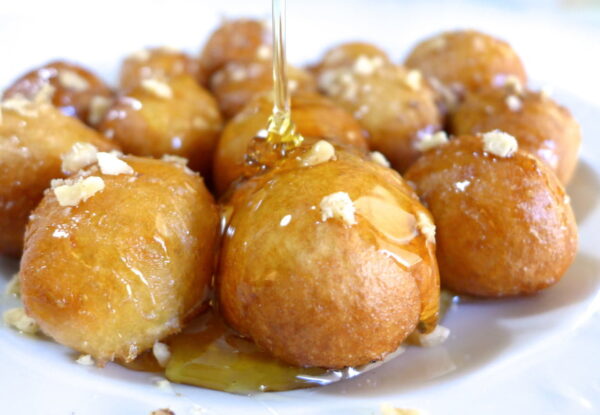 Close-up of Greek ‘Loukoumades’ are made from dollops of doughy batter fried in oil and covered with honey