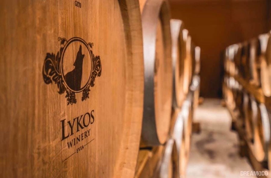 personalized wooden wine barrels sign with the 'Lykos Winery' logo into the cellar