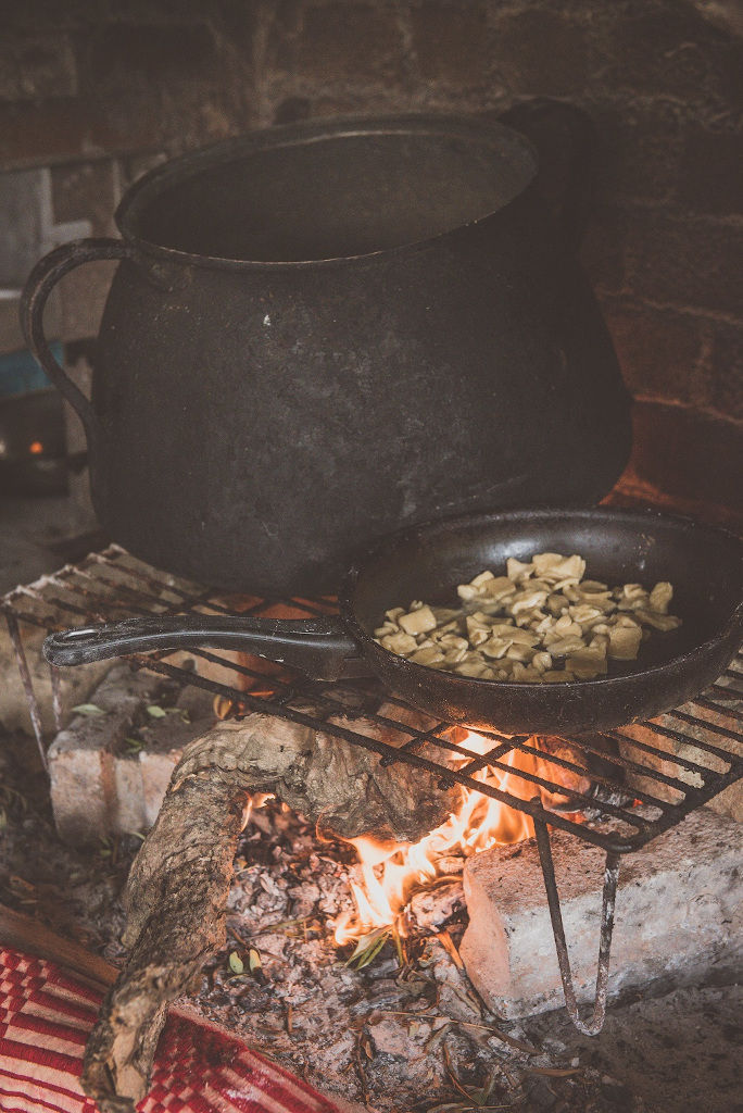 baking hilopites pasta in stone oven at Maggiri facilities