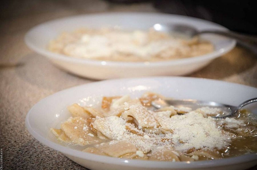 plate with hilopites pasta and grated cheese at Maggiri facilities