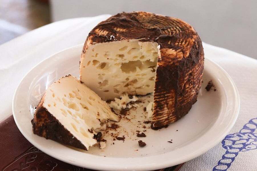 Close-up of round Greek ‘Manoura’ yellow cheese 