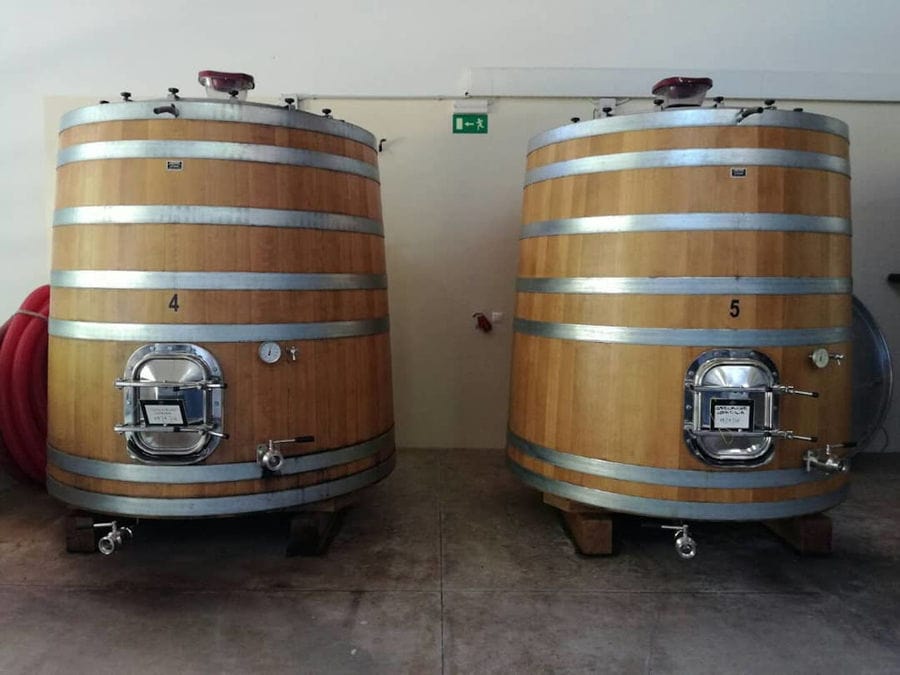 two wine barrels on the wood panels at Manousakis Winery plant