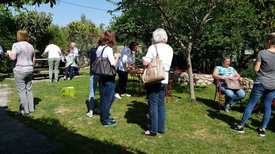 a group of tourists relaxing in the garden of 'Marianna'