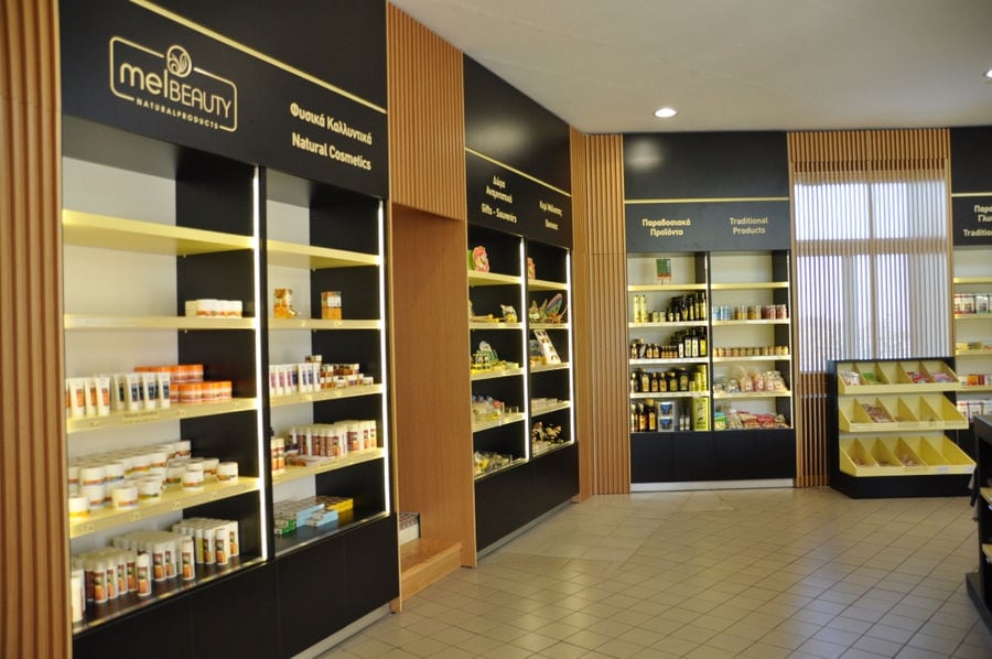 'Melissokomiki Dodekanisou Bee Museum' shop with cosmetics and honey products on the shelves