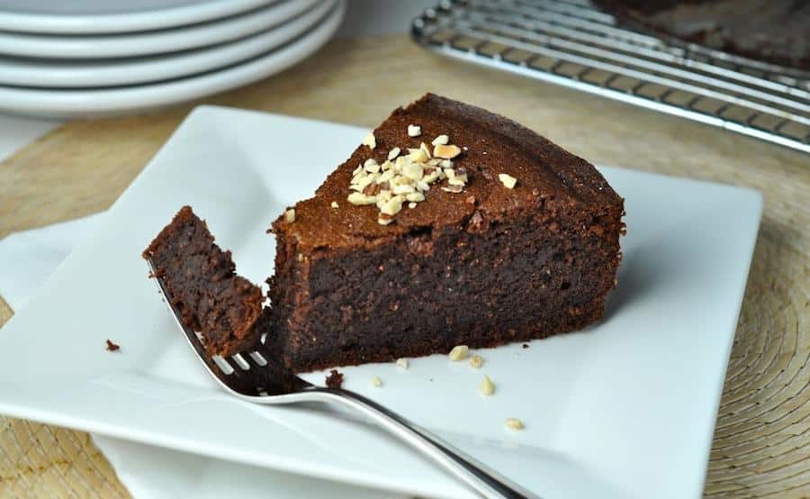 white plate with piece of melachrino cake