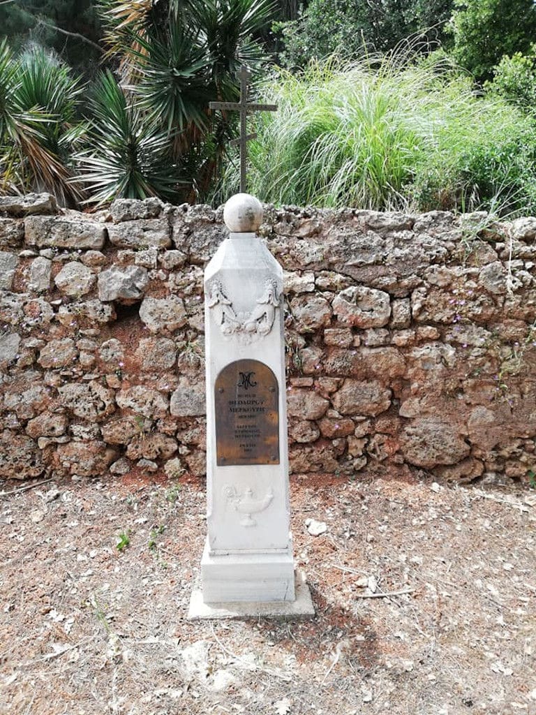 plaster commemorative plaque front the stone wall into 'Mercouri Estate' garden