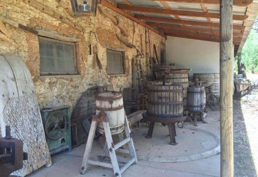 old wood barrels and manual grape press at 'Mercouri Estate' facilities