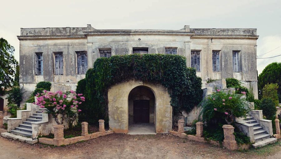 ruins of a stone house her entrance is marked, on either side, by two staircase at 'Mercouri Estate'