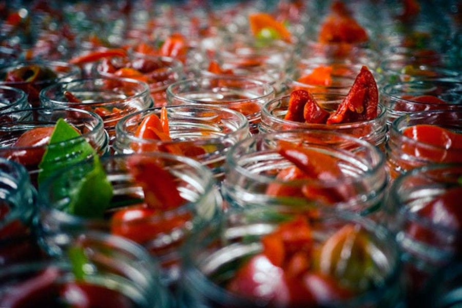 glass jars with Florina red peppers at 'Naoumidis All Peppers' plant