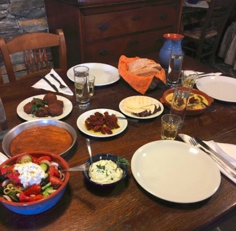 plates with various cooked foods like fried meet balls and sausage, salad pancake at 'Narlis Farm'