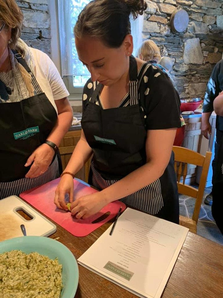 woman taking cooking lessons at 'Narlis Farm' kitchen and making pie cheese