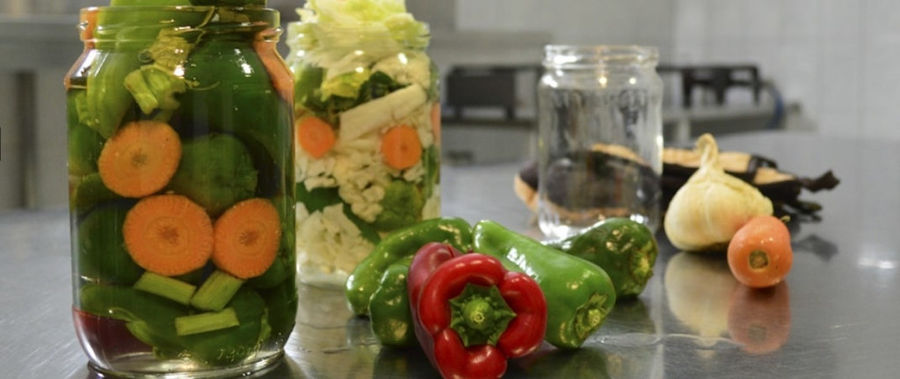 glasses jars with pickles like peppers and cauliflowers and carrots from 'Voskopoulos Handicraft'