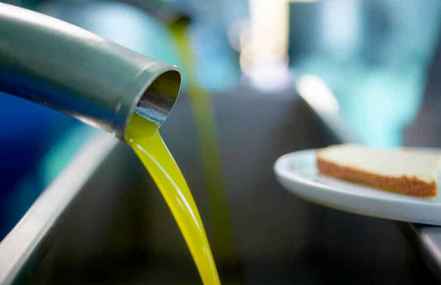 close-up of olive oil flowed from pump at Melas Epidauros Olive Oil Domain|Melas Epidauros Olive Oil Domain logo
