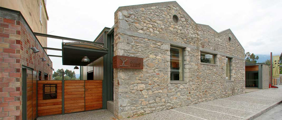 wooden entrance of 'Olive and Olive Oil Museum, Sparta' stone building