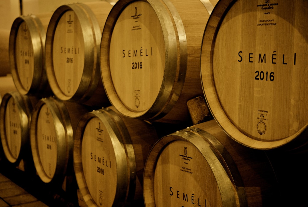 personalized wooden wine barrels sign with the Semeli Estate logo into the cellar||Semeli Estate logo company