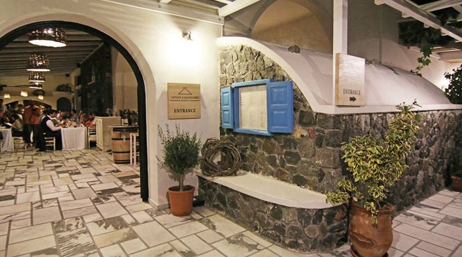 stone entrance with flower pots of 'Artemis Karamolegos Winery' restaurant