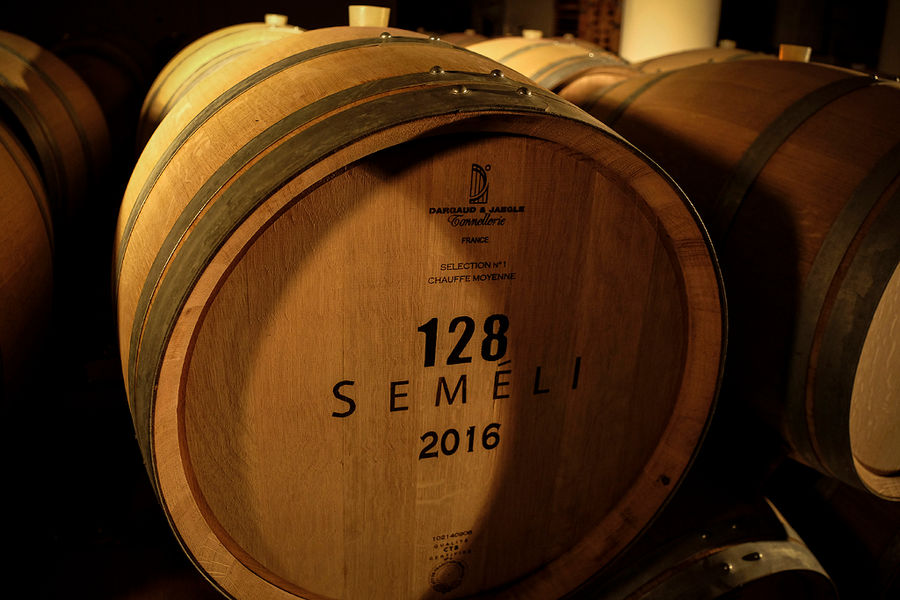 personalized wooden wine barrel sign with the 'Semeli Estate' logo into the cellar