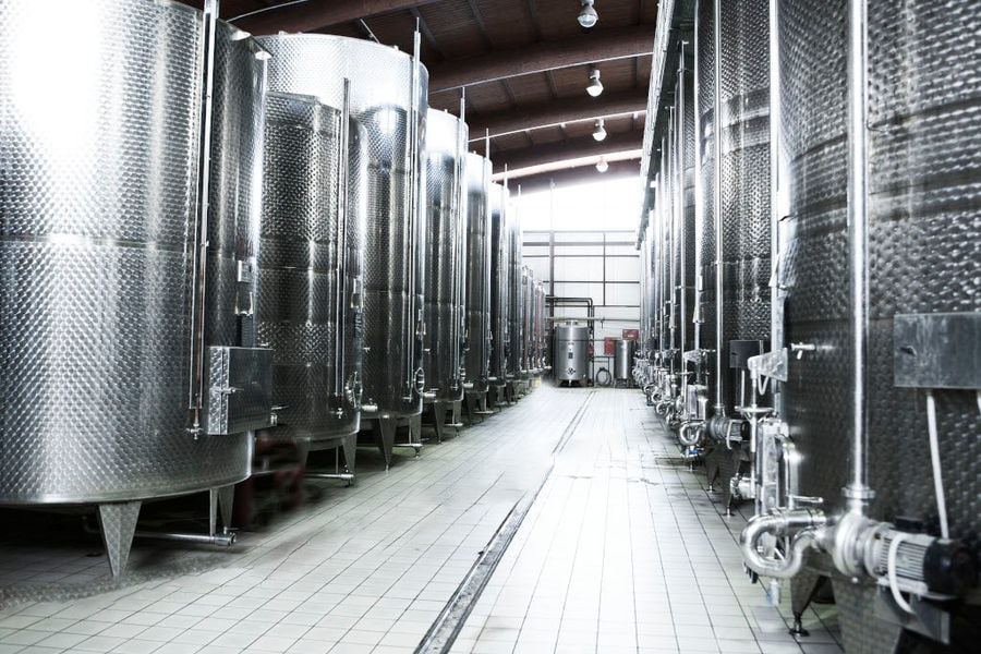 lying aluminum wine storage tanks at 'Semeli Estate' plant