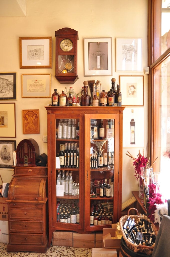 'Tentoura Castro Distillery' store with antiques and locked with bottles and old pendulum clock