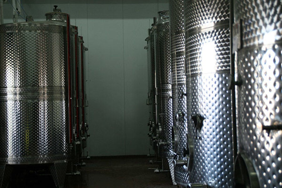 aluminum wine fermentation tanks at 'Theodorakakos Estate winery' facilities