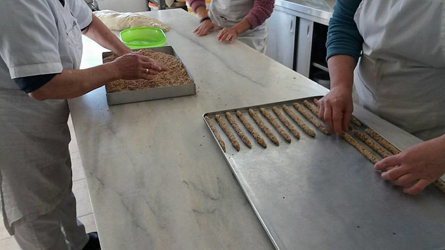 women making sesame seed breadsticks at The Apolloniatisses workshop