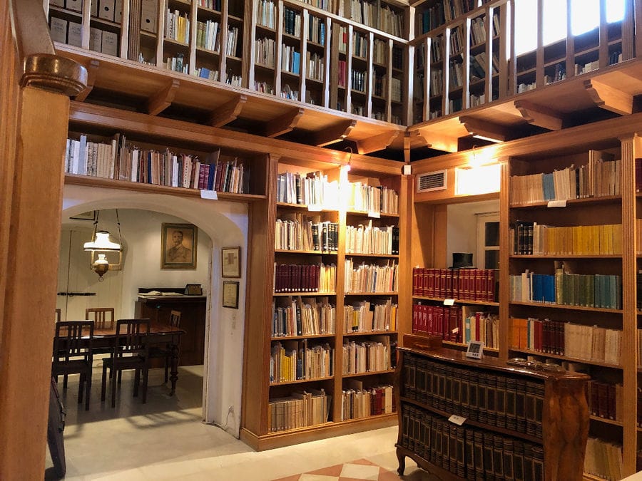 'Theotoky Estate' library with an inside arcade and stacked books on top of each other