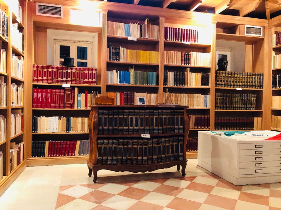 bookcase with two shelves and books with leather covers at 'Theotoky Estate' library