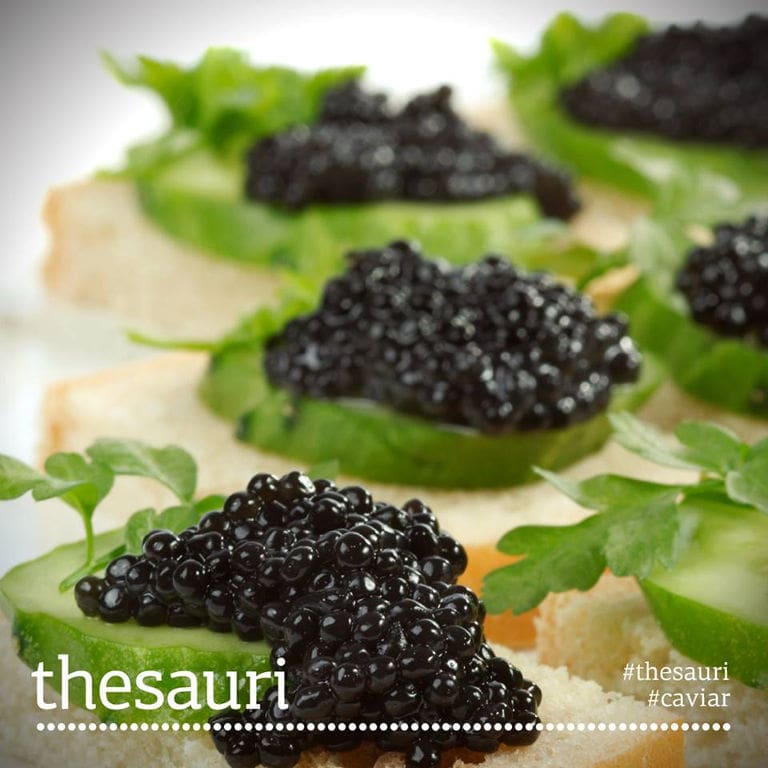 close-up of caviar eggs on green leaves from 'Thesauri Caviar'