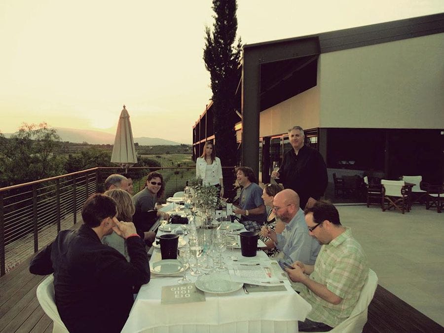 tourists tasting wines at Domaine Papagiannakos terrace