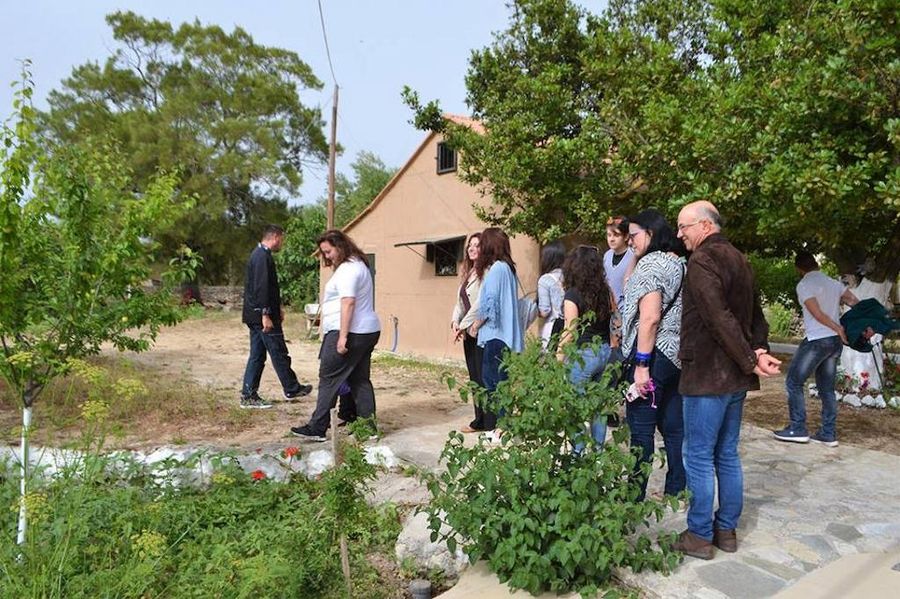 a group of tourists visiting En Kefallinia Organic Farm Restaurant garden