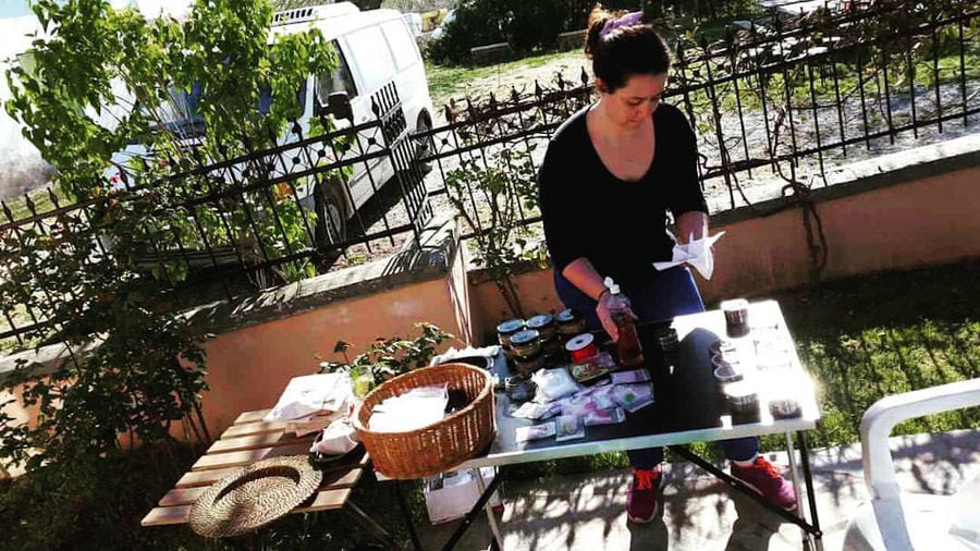 woman cooking outside in 'The Trinity Farm' garden