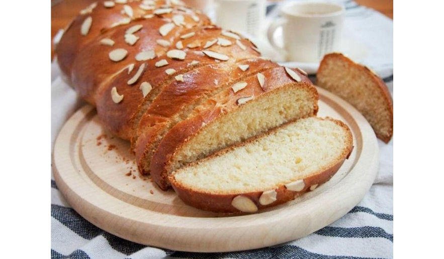 Close-up of pieces of Greek ‘Tsoureki’ means sweet bread like cake covered with almonds