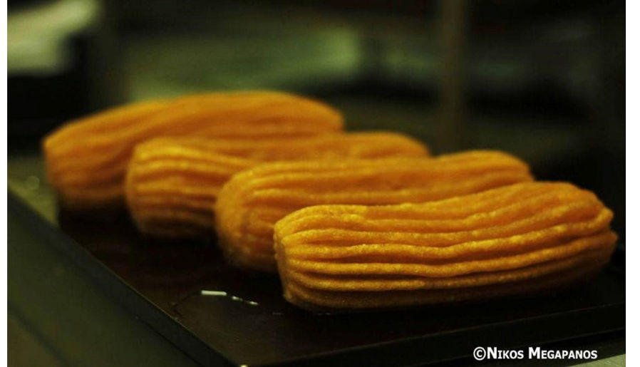 Close-up of pieces of Greek ‘Tulumba’ is a deep-fried dessert soaked in syrup and made from dough