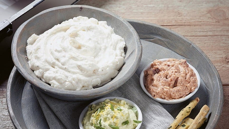 Bowl with Greek ‘tirosalata’ is salad with feta cheese and olive oil