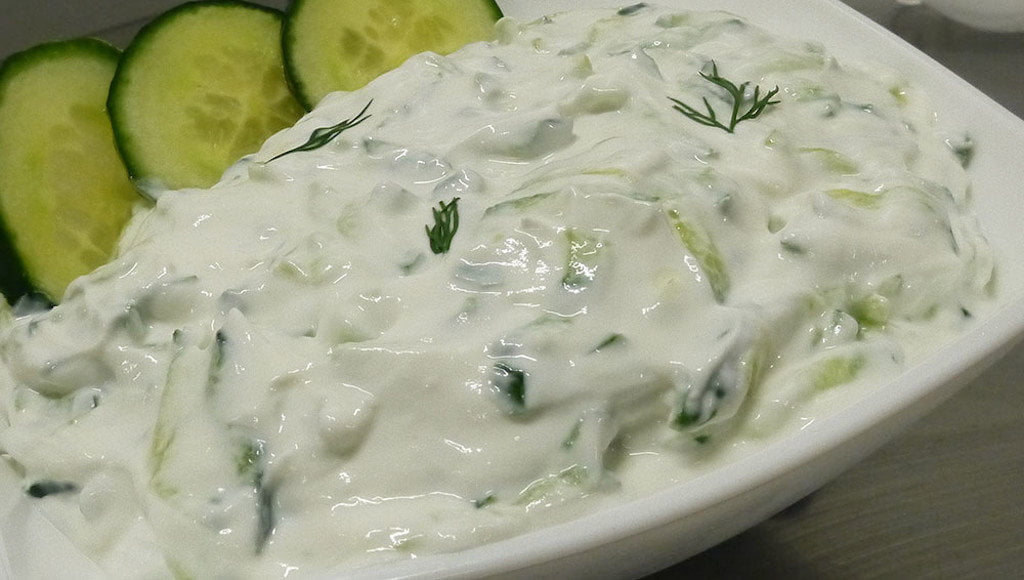 Close-up of Greek ‘Tzatziki’ means yogurt with pieces of cucumber