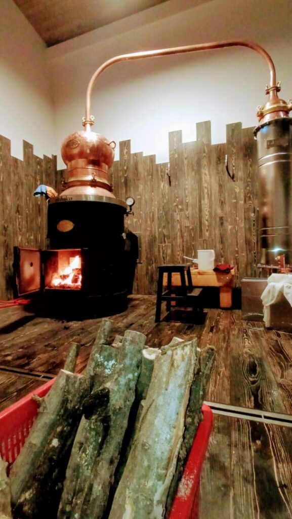 Wood stove with a stool and woods in a basket