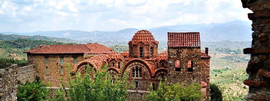 Greece with the mountains and monastiry in the background