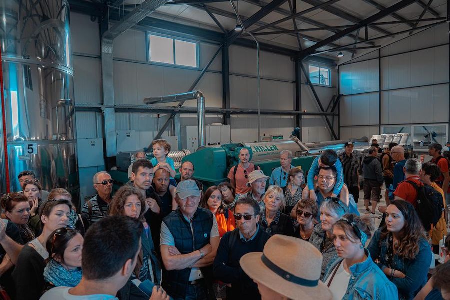 visitors listening to a guide at Politakis Olive Oil Mill premises