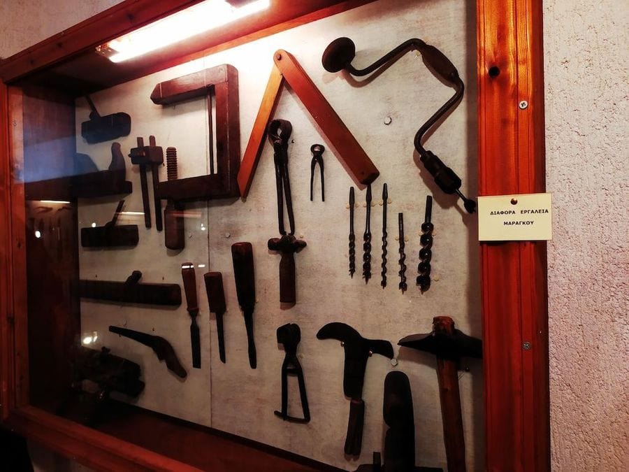 window with old tools on the wall at Tzivani Bio Wines