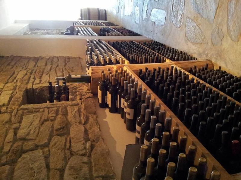 wine bottles on the stone floor at cellar of Afianes wines