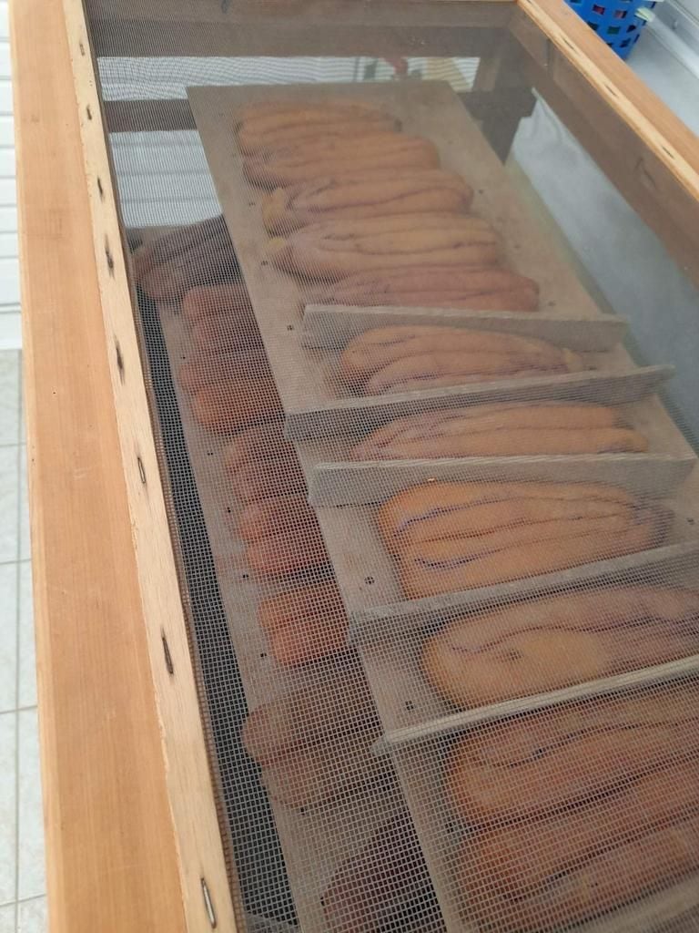 Close-up of wooden frame with sieve shelves on which they lie botarga from Stefanos Kaneletis