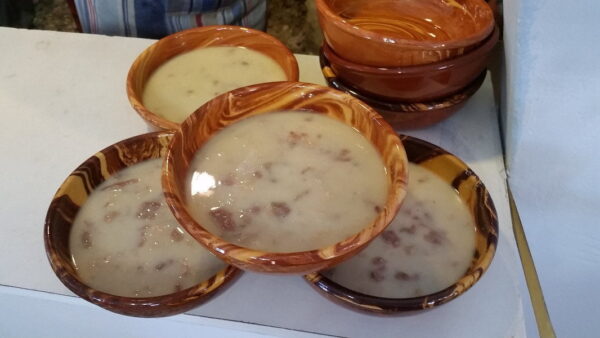 Ceramic bowls with Greek ‘Xydato’ is a soup with goat meat and offal