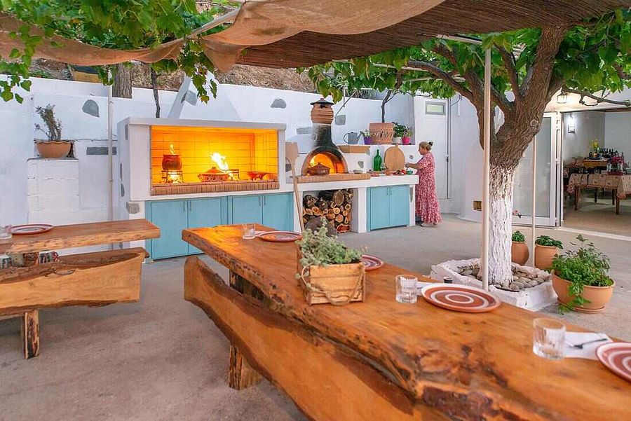 A cozy patio with a fire pit and a table, perfect for outdoor gatherings and relaxation.