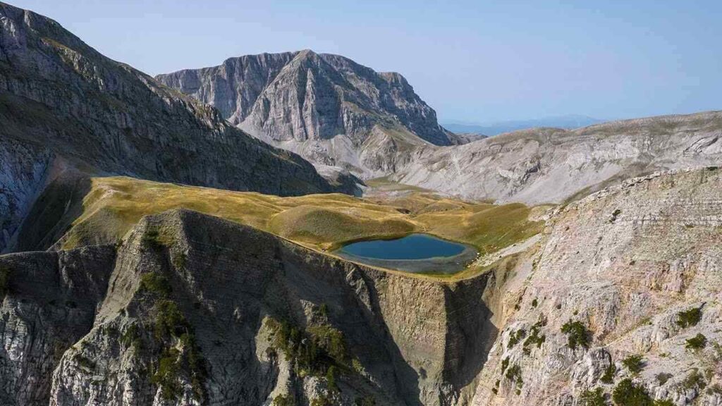 a lake surrounded by mountains