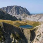 a lake surrounded by mountains