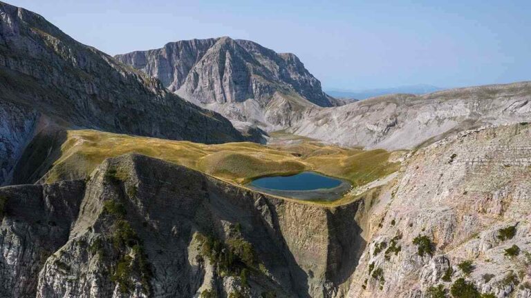 a lake surrounded by mountains