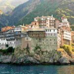 Mount Athos on a cliff above water