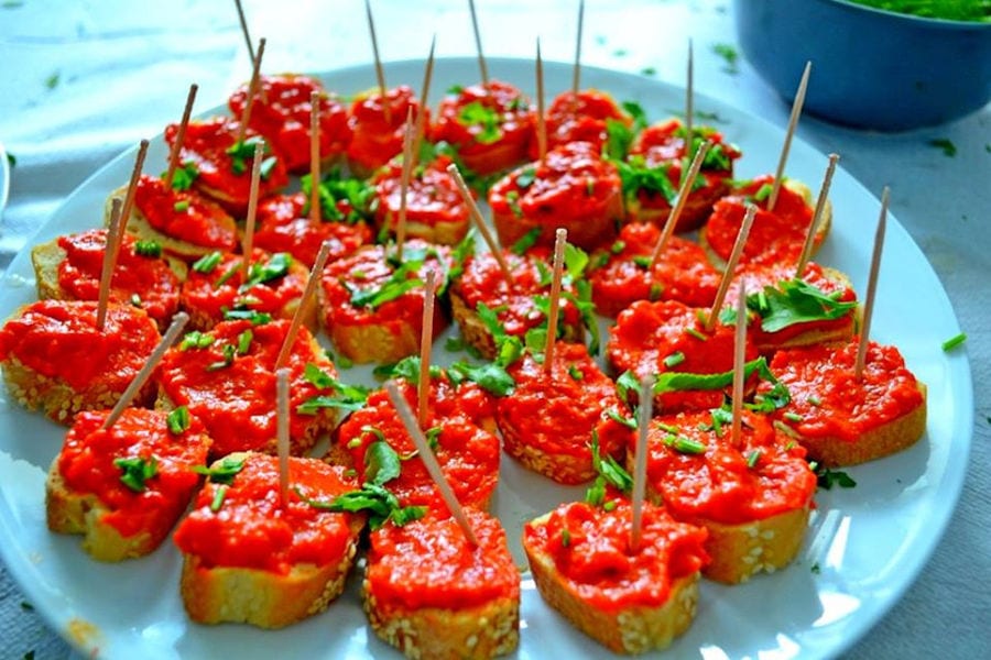 pieces of bread with tomatoes on the top at 'Aidarini Winery'