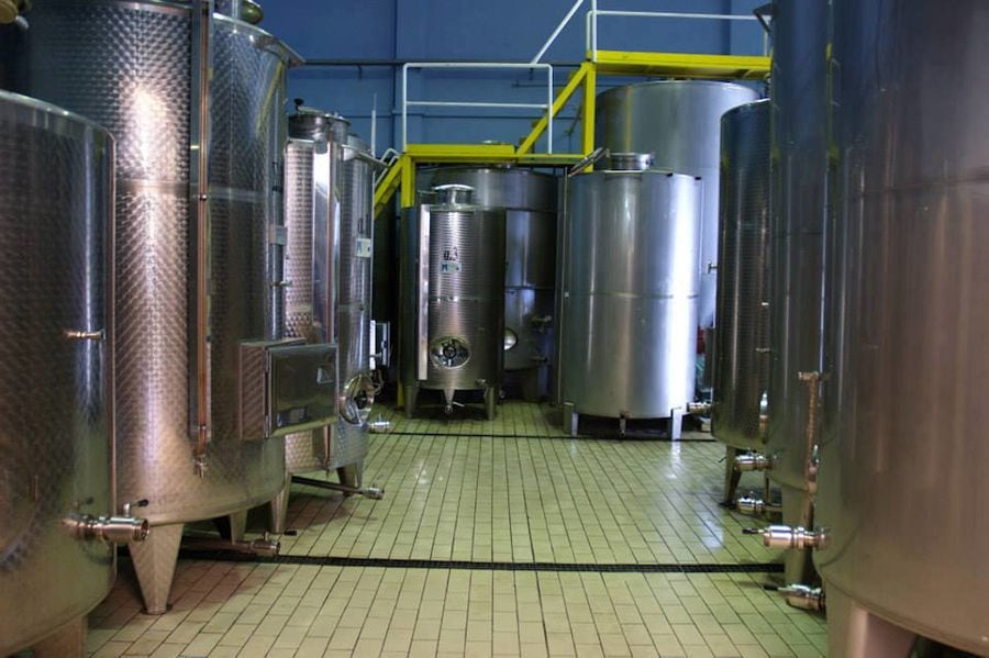 lying aluminum wine storage tanks at 'Aidarini Winery' plant